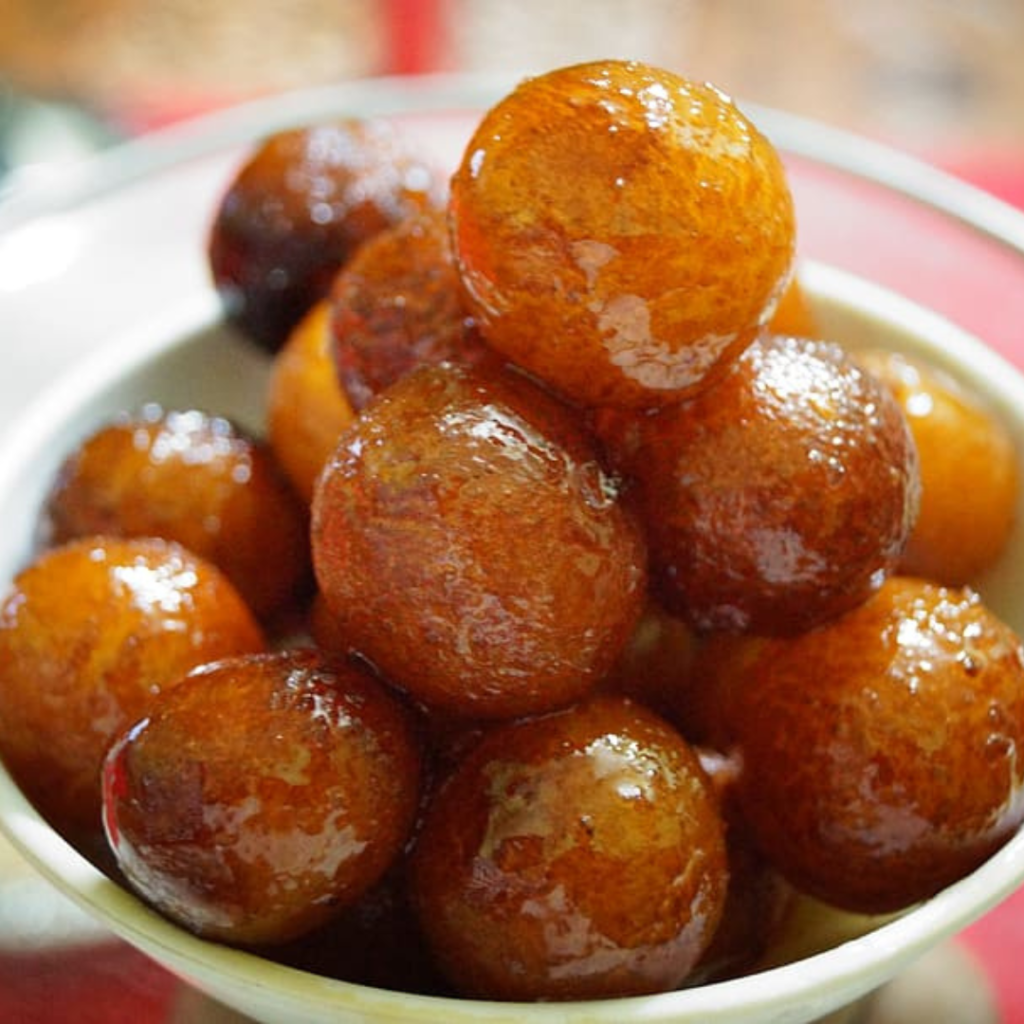 "Authentic Gulab Jamun recipe for Indian dessert" "Easy homemade Gulab Jamun with step-by-step guide" "Gulab Jamun preparation tips for fluffy and soft sweets" "Traditional Indian Gulab Jamun made with khoya" "Best Gulab Jamun recipe for Diwali and festive occasions" "How to make Gulab Jamun from scratch" "Gulab Jamun serving ideas and presentation tips" "Delicious Gulab Jamun served with rose syrup" "Gulab Jamun – a popular Indian sweet treat" "Health benefits of Gulab Jamun and variations"